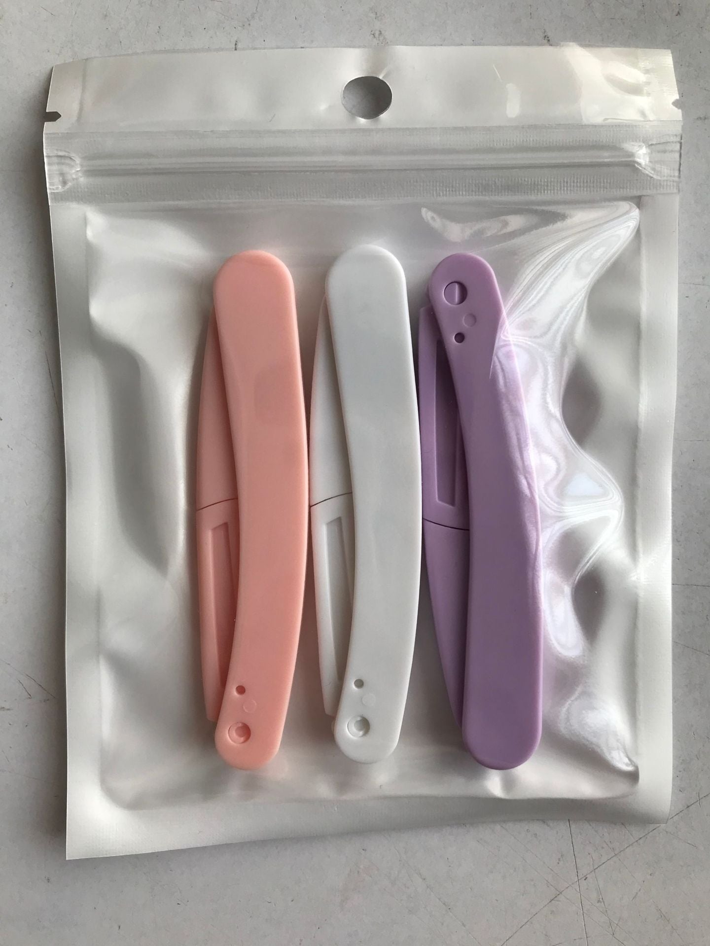 BrowPerfect rasoir sourcils rose violet blanc couleurs
